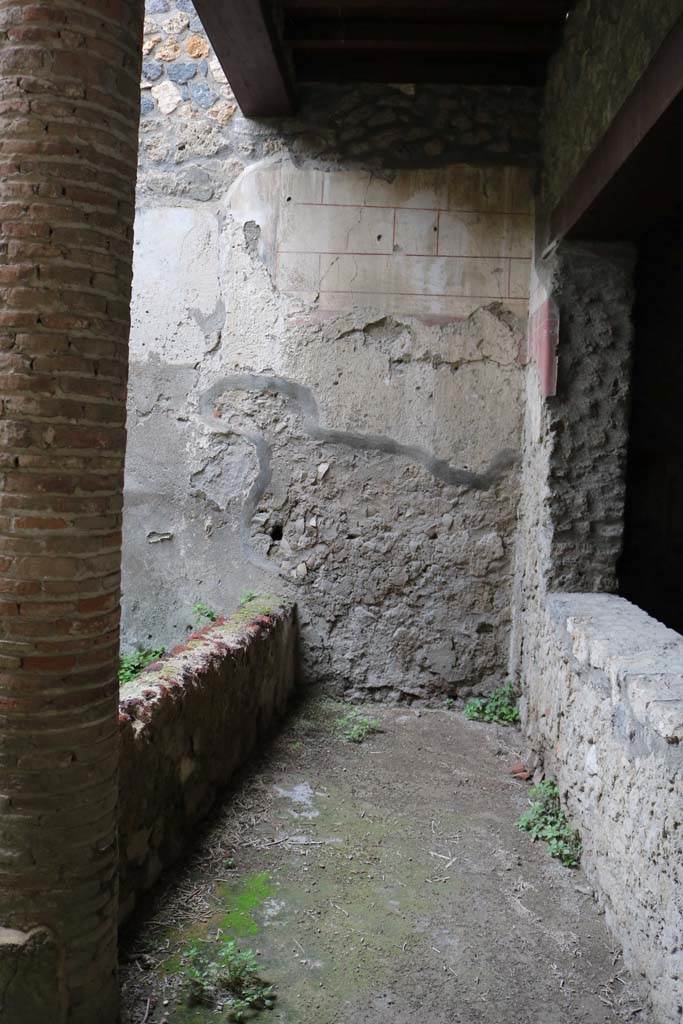 I.12.3 Pompeii. December 2018. 
Looking west along passageway on north side of garden, with window from triclinium.
Photo courtesy of Aude Durand.