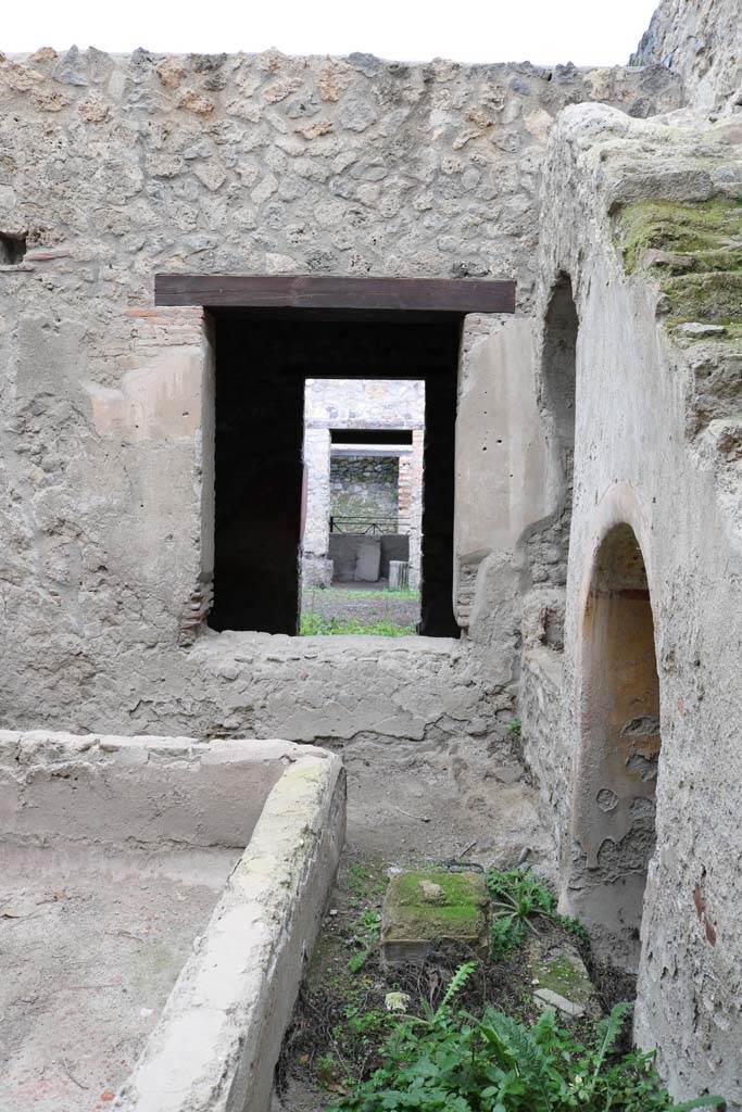 I.12.5 Pompeii. December 2018. 
Looking north from courtyard/garden towards window into triclinium, across atrium to doorway to caupona.
Photo courtesy of Aude Durand.