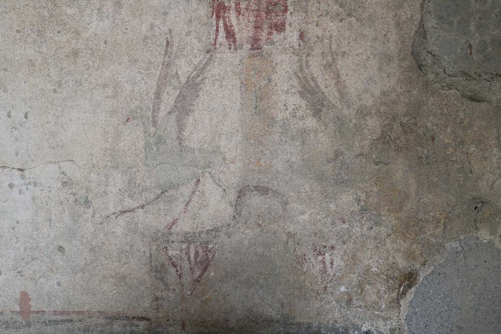 I.12.5 Pompeii. December 2018. Detail of painted decoration on east side of middle zone of north wall. 
At the base of the painted candelabra are two painted herons. Photo courtesy of Aude Durand.