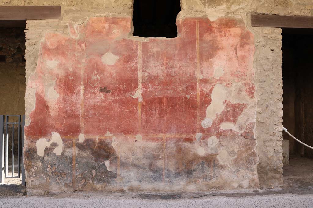 I.12.5 Pompeii, on left. December 2018. 
Looking south towards wall between two doorways with 1.12.4 on right. Photo courtesy of Aude Durand.