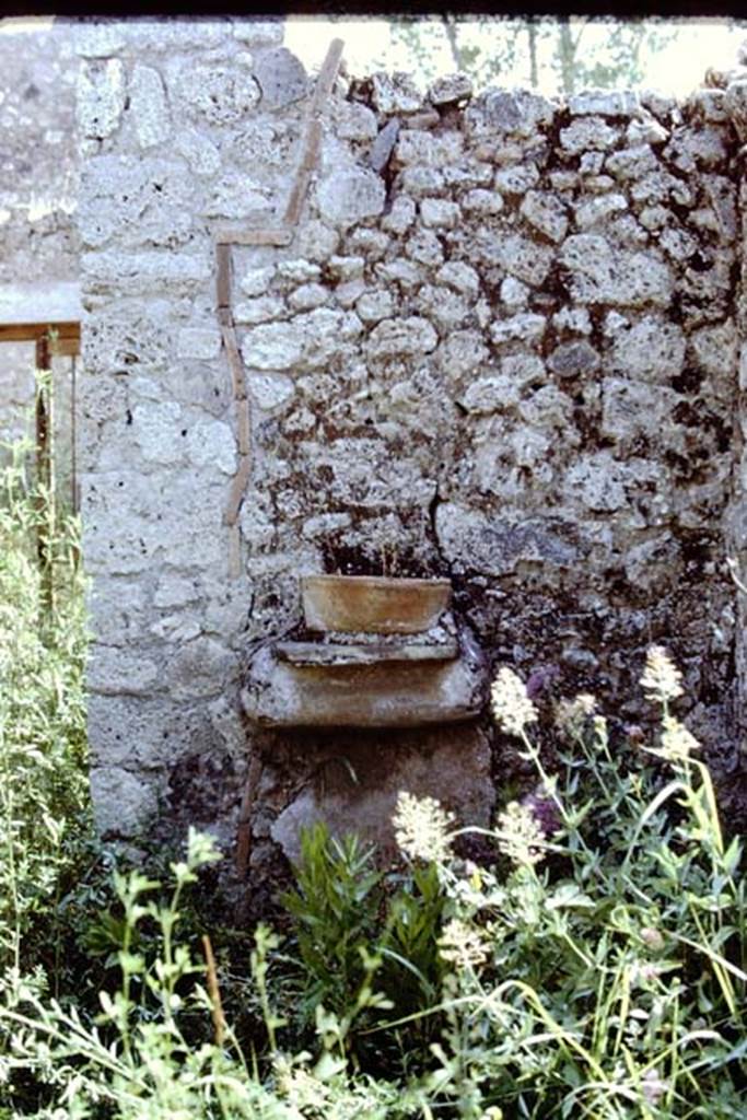 I.12.6 Pompeii. 1971. Terracotta pot (washbowl) on shelf on east side of south portico. Photo by Stanley A. Jashemski.
Source: The Wilhelmina and Stanley A. Jashemski archive in the University of Maryland Library, Special Collections (See collection page) and made available under the Creative Commons Attribution-Non Commercial License v.4. See Licence and use details. J71f0150