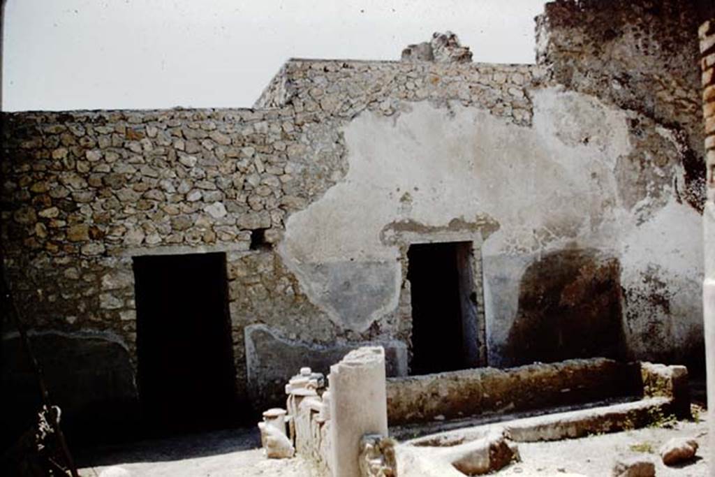 I.12.8 Pompeii. 1961. Looking towards west side of peristyle garden, and doorways to rooms 10 and 11. Photo by Stanley A. Jashemski.
Source: The Wilhelmina and Stanley A. Jashemski archive in the University of Maryland Library, Special Collections (See collection page) and made available under the Creative Commons Attribution-Non Commercial License v.4. See Licence and use details.
J61f0554