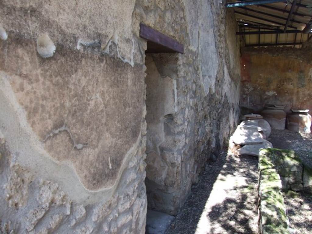I.12.8 Pompeii.  March 2009.   Room 9.  Looking north along west portico, and doorway to room 11.
