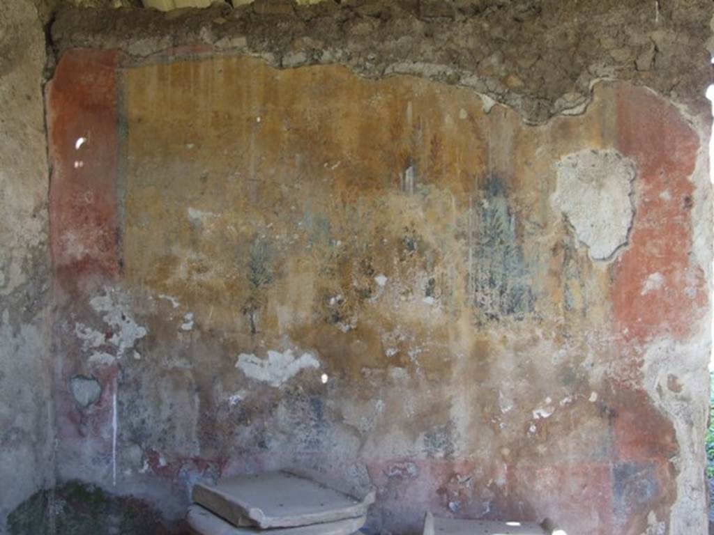 I.12.8 Pompeii. March 2009. Room 9, west side of north wall with remains of garden painting.  According to Curtis, the major panels of the painting depicted a garden scene with thick foliage. The left panel was much deteriorated, but both panels contained paintings of life-like birds standing on branches of green trees and shrubbery. According to Jashemski, she could see four song-birds in a thicket of ivy, flowering oleanders and myrtles.
The bottom part of the painting was destroyed. See Jashemski, W. F., 1993. The Gardens of Pompeii, Volume II: Appendices. New York: Caratzas, (p.326 and fig.378)