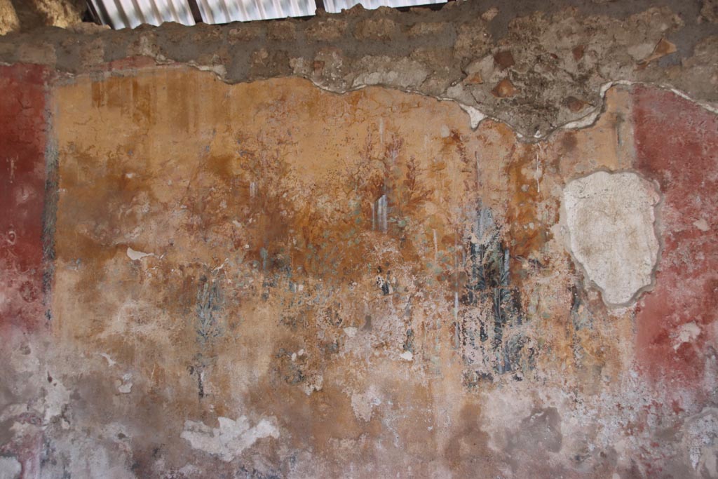 I.12.8 Pompeii. October 2022. 
Peristyle 9, west side of north wall with detail of remaining garden painting. Photo courtesy of Klaus Heese.