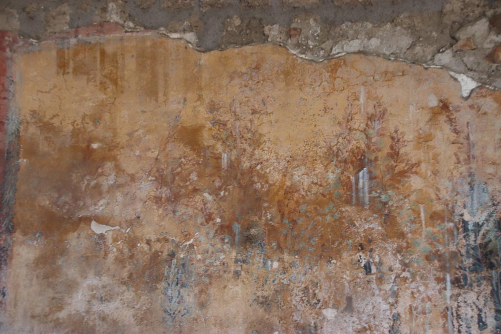 I.12.8 Pompeii. October 2022. 
Peristyle 9, west side of north wall with detail of remaining garden painting. Photo courtesy of Klaus Heese.