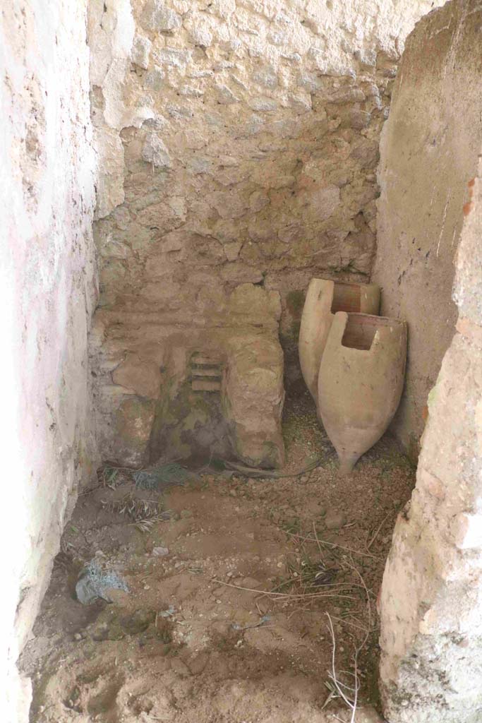 I.12.8 Pompeii. December 2018. 
Room 12, looking east through doorway into latrine. Photo courtesy of Aude Durand.