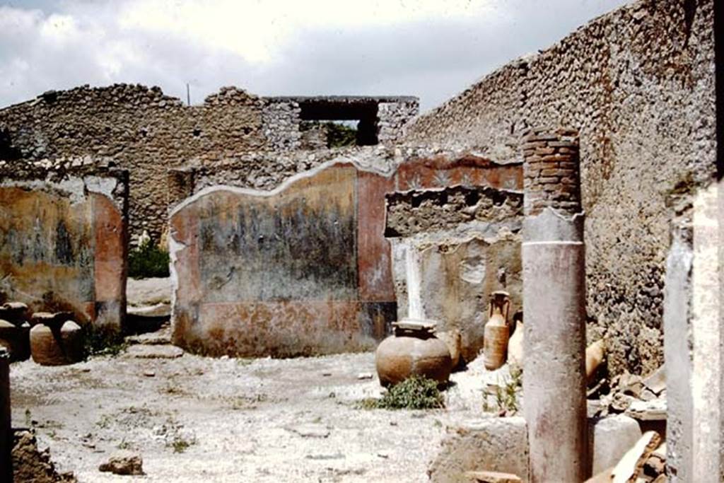 I.12.8 Pompeii. 1961. Looking north along east side of peristyle garden.  Photo by Stanley A. Jashemski.
Source: The Wilhelmina and Stanley A. Jashemski archive in the University of Maryland Library, Special Collections (See collection page) and made available under the Creative Commons Attribution-Non Commercial License v.4. See Licence and use details.
J61f0547