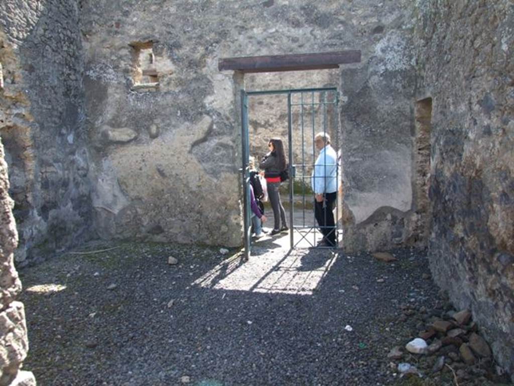 I.12.8 Pompeii. March 2009. Room 1, entrance room, looking south to doorway onto Via di Castricio.