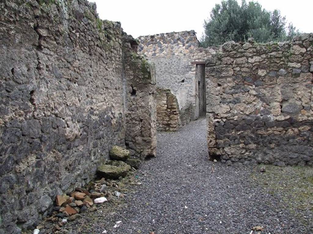 I.12.8 Pompeii. December 2006. Looking north from room 1, through doorway in north wall into room 5.