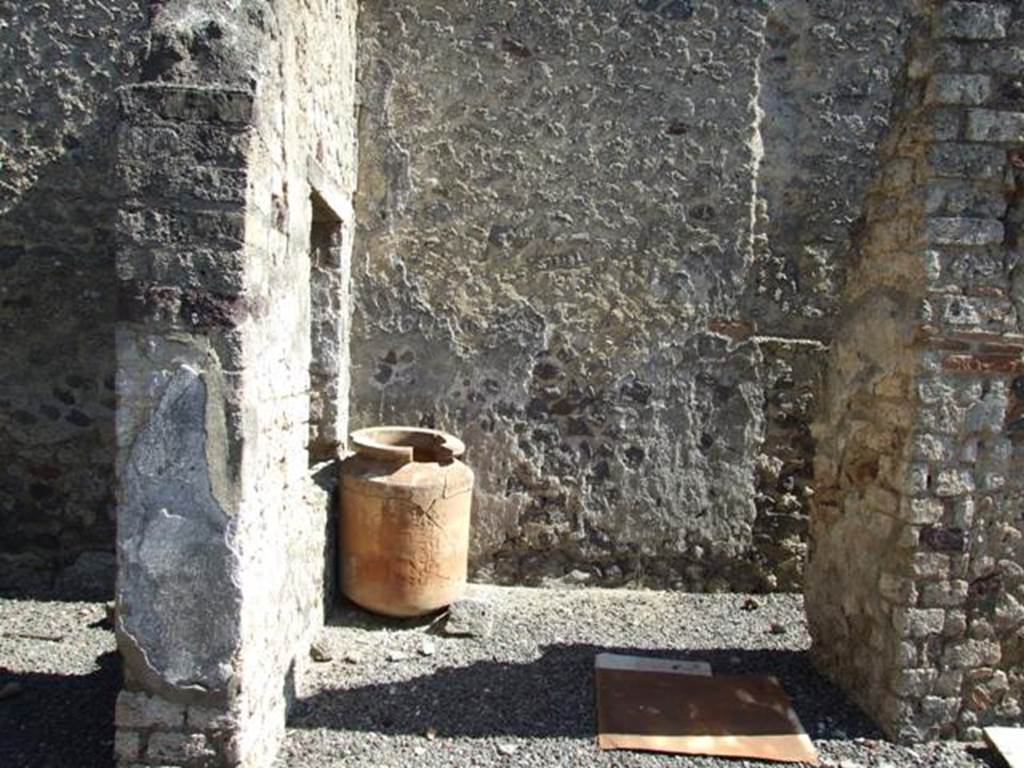 I.12.8 Pompeii. March 2009. Room 7, looking east, with doorway to room 8, on right, with south portico, on left.