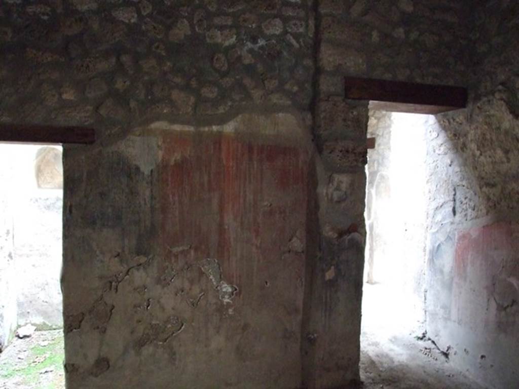 I.12.11 Pompeii. December 2007. Triclinium, looking towards south wall with two doorways.
On the left leading to a room with two niches in south wall. On the right is the doorway leading to the garden area.