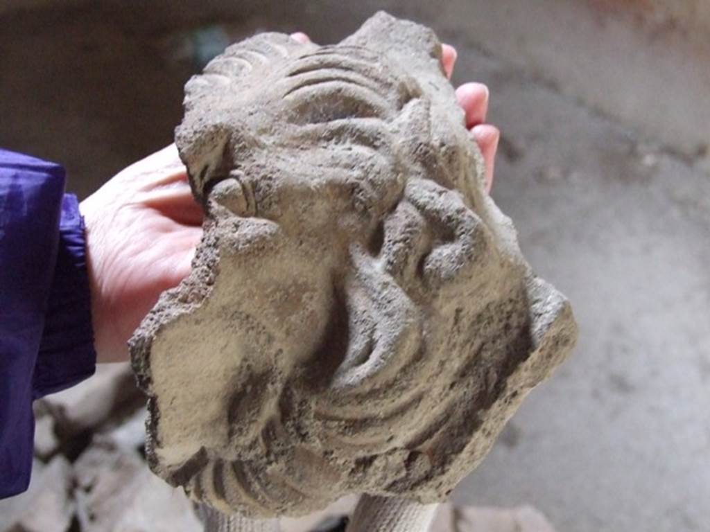I.12.11 Pompeii.  December 2007.  Remains of a lions face on a grondaia, or water-spout.