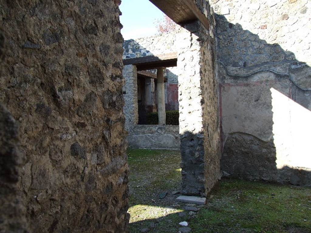 I.12.11 Pompeii. December 2006. Room to east of atrium, looking north towards west wall with doorway to atrium.