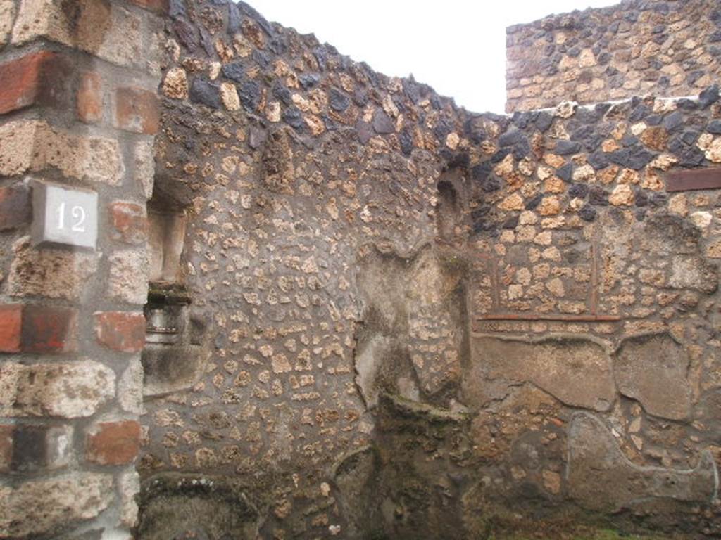 I.12.12 Pompeii. December 2004. Looking towards west wall of shop, from entrance doorway.