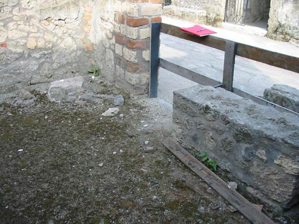I.12.12 Pompeii. May 2003. Looking towards south-east corner of shop-room, and entrance doorway. Photo courtesy of Nicolas Monteix.
