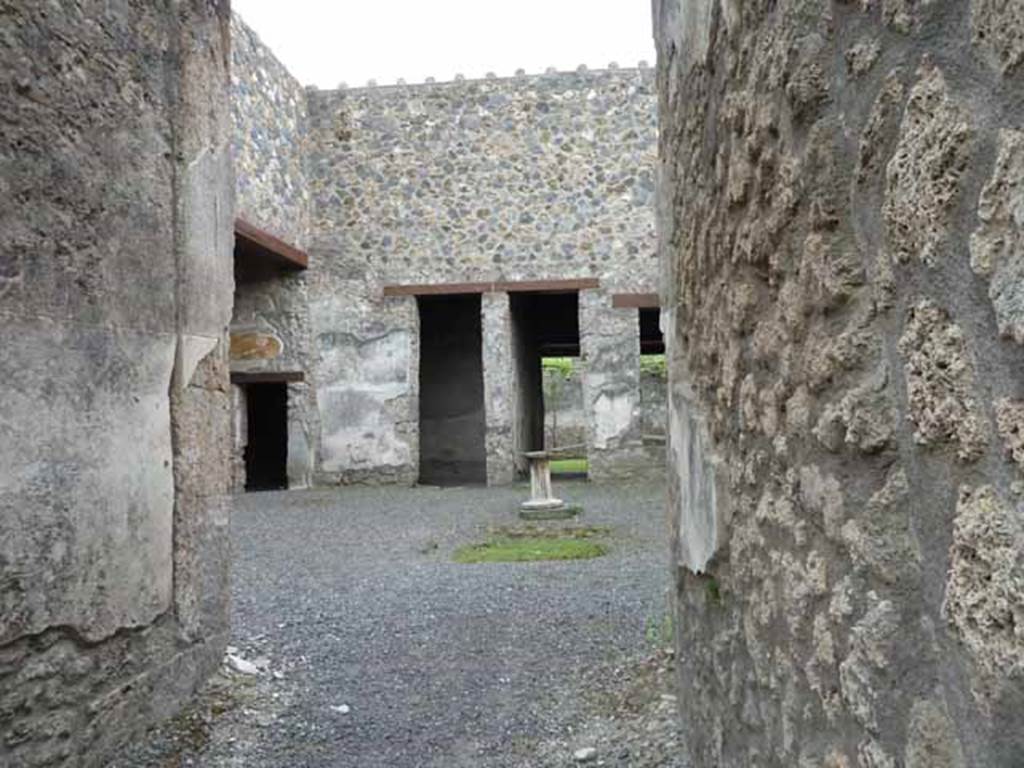 I.13.2 Pompeii. May 2010. Looking towards south-east side of atrium, with small doorway in south wall of left ala.