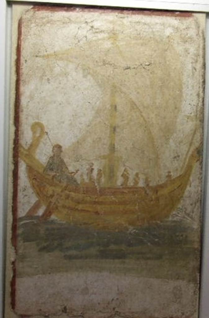 I.13.9 Pompeii. Venus on a boat, wall painting from exterior wall on south side of the entrance.   Photograph taken December 2006, Boscoreale Antiquarium. 
According to Varone, underneath the painting of a boat with open sails and Venus at the rudder acting a helmsman for the sailors, was a Greek inscription painted in black letters, saying “Venus the Saviour”. This was CIL IV 9867 but is no longer conserved.  See Varone, A., 2002. Erotica Pompeiana: Love Inscriptions on the Walls of Pompeii, Rome: L’erma di Bretschneider. (p.24)
According to Varone and Stefani, the inventory number of the painting should be 20697.  See Varone, A. and Stefani, G., 2009. Titulorum Pictorum Pompeianorum, Rome: L’erma di Bretschneider, (p.158)   According to Frohlich, the SAP inventory number was 2212-4.  See Fröhlich, T., 1991. Lararien und Fassadenbilder in den Vesuvstädten. Mainz: von Zabern. (p.311, F.13, taf 17,10)