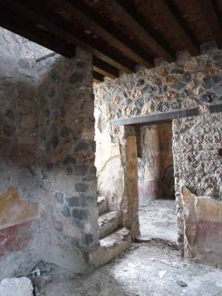 I.13.9 Pompeii. May 2010. South side of small atrium, with steps to upper floor and doorway to oecus.