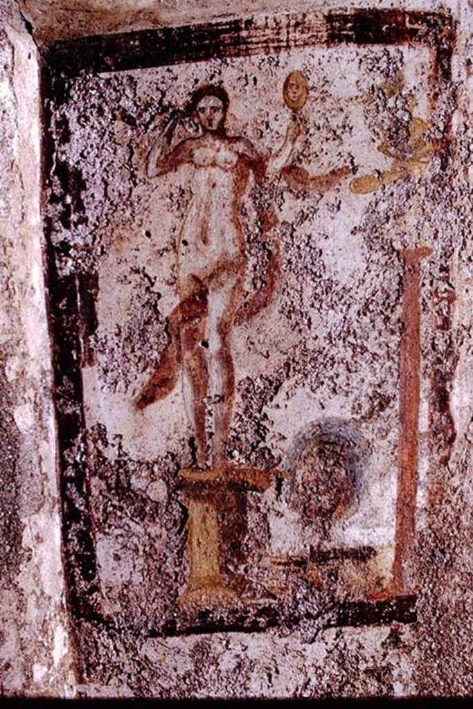 I.13.16 Pompeii. 1972. North wall, painting of Venus with mirror and remains of a statue of Priapus on a tall pedestal, on the right. Photo by Stanley A. Jashemski. 
Source: The Wilhelmina and Stanley A. Jashemski archive in the University of Maryland Library, Special Collections (See collection page) and made available under the Creative Commons Attribution-Non Commercial License v.4. See Licence and use details. J72f0385