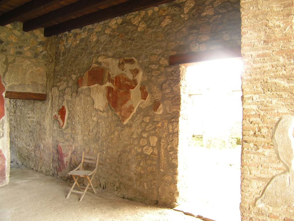 I.14.2 Pompeii. July 2008. Room H, south wall. 
The doorway on the left is to room I, the doorway on the right leads to the atrium.
Photo courtesy of Guilhem Chapelin.