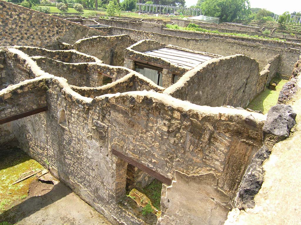 I.14.2 Pompeii. July 2008. Window to Garden M, lower centre, and tops of walls of rooms belonging to I.14.1, at rear.
Photo courtesy of Guilhem Chapelin.