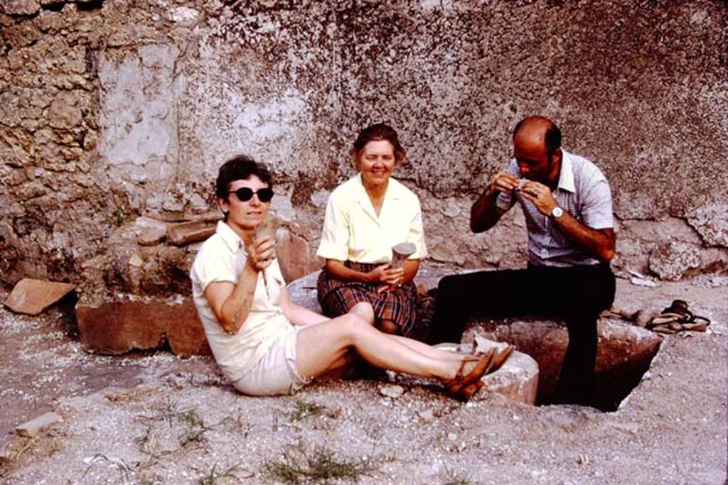 I.14.2 Pompeii. 1972. Looking south across triclinium, with Wilhelmina and two of her graduate students. Against the south wall, on the left, the rectangular table can be seen. Photo by Stanley A. Jashemski. 
Source: The Wilhelmina and Stanley A. Jashemski archive in the University of Maryland Library, Special Collections (See collection page) and made available under the Creative Commons Attribution-Non Commercial License v.4. See Licence and use details. J72f0341