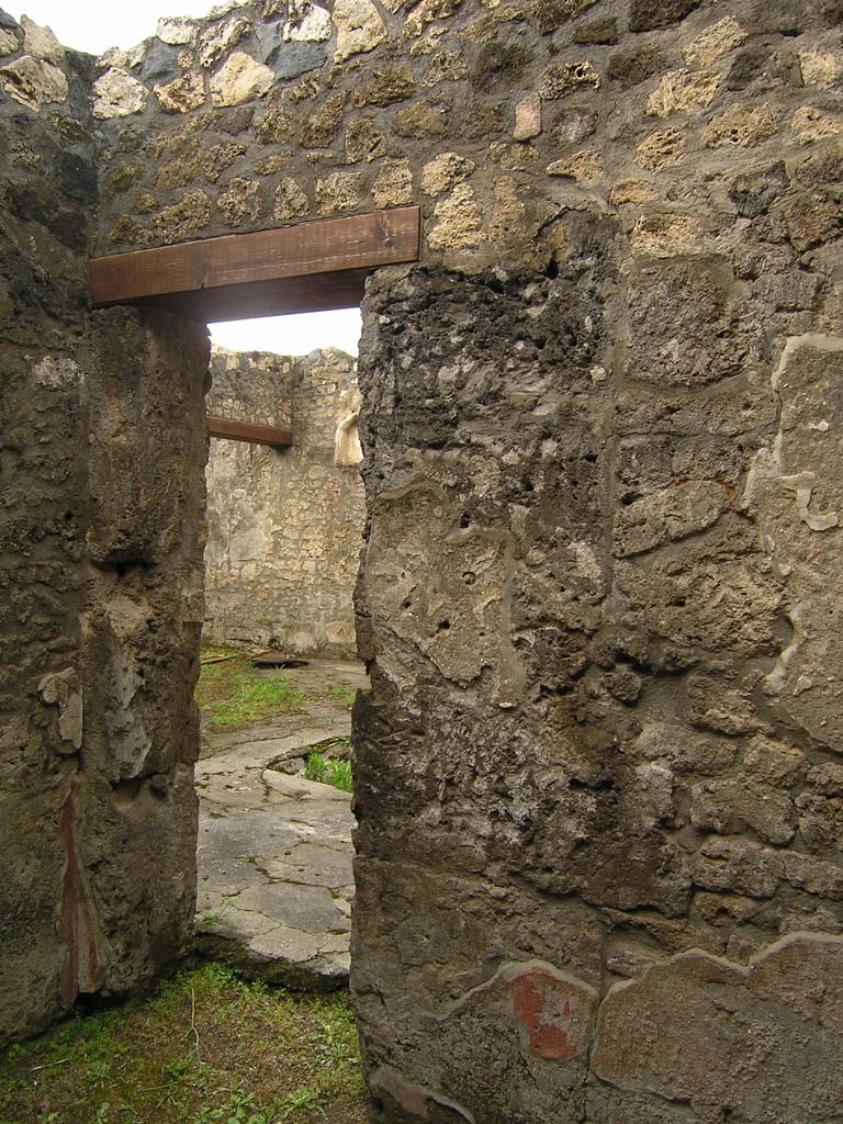 I.14.2 Pompeii. July 2008. Room C, south west corner, west wall and doorway to atrium.  
Photo courtesy of Guilhem Chapelin.