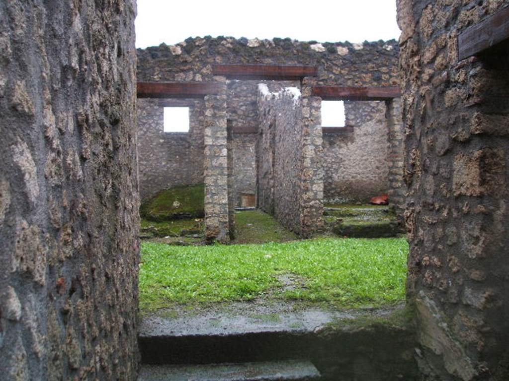 I.14.3 Pompeii. December 2005. 
Looking west across atrium to doorways to oecus, garden area and triclinium.