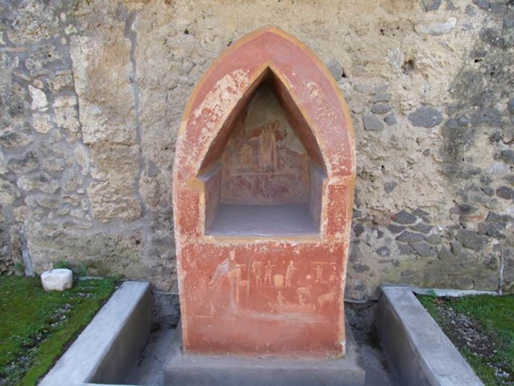 I.14.7 Pompeii. March 2009. 
Lararium against south wall of garden area, with water channel around base.
See Fröhlich, T., 1991. Lararien und Fassadenbilder in den Vesuvstädten. Mainz: von Zabern, L33, p. 262-3, Taf. 5,1.