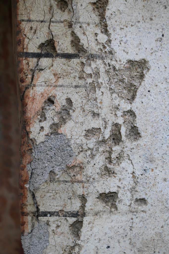 I.14.7 Pompeii. December 2018. 
Detail of the wall at the north end of the lararium on west wall of the garden area. Photo courtesy of Aude Durand.