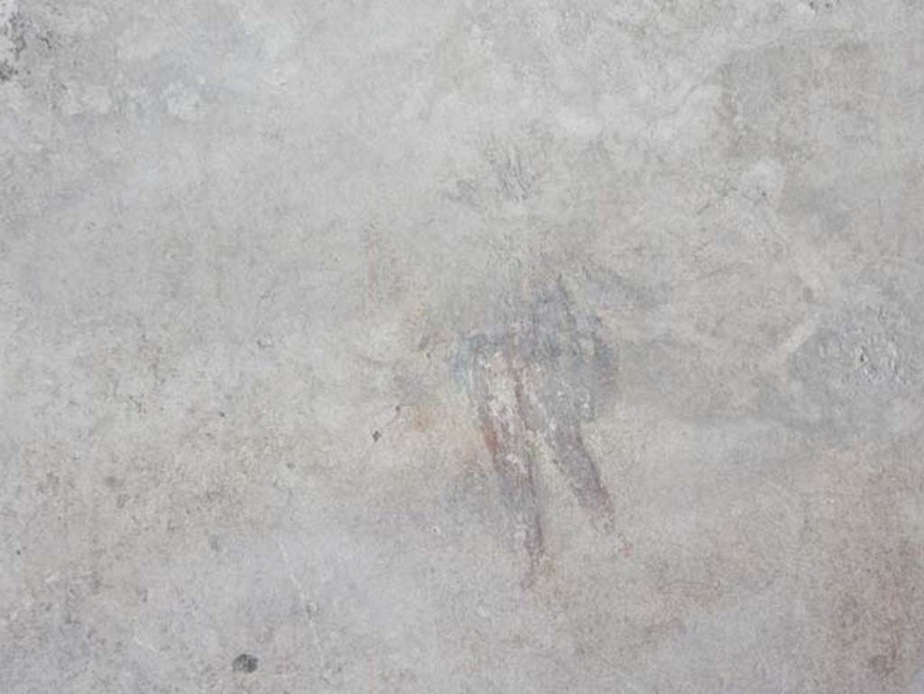 I.14.12, Pompeii. May 2018. Room 2, detail of remains of painted flying cupid, from east end of north wall.
Photo courtesy of Buzz Ferebee