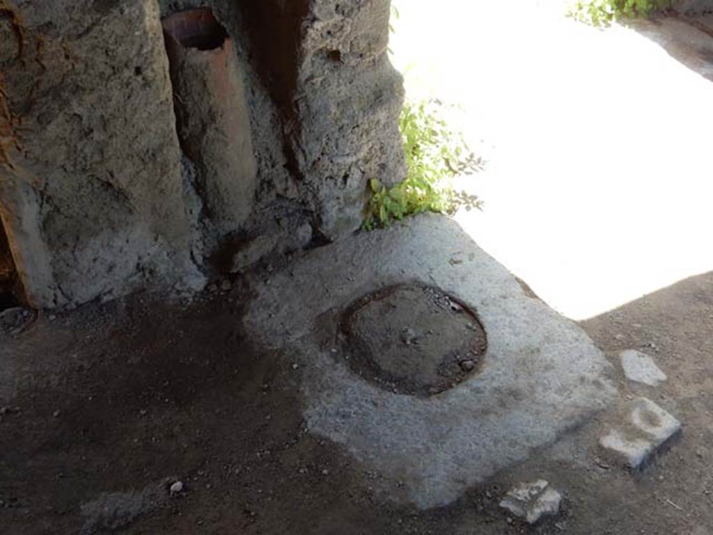 I.14.12, Pompeii. May 2018. Cistern mouth in south-west corner of east portico 32, looking south towards corridor 9 to entrance at I.14.12. Photo courtesy of Buzz Ferebee.