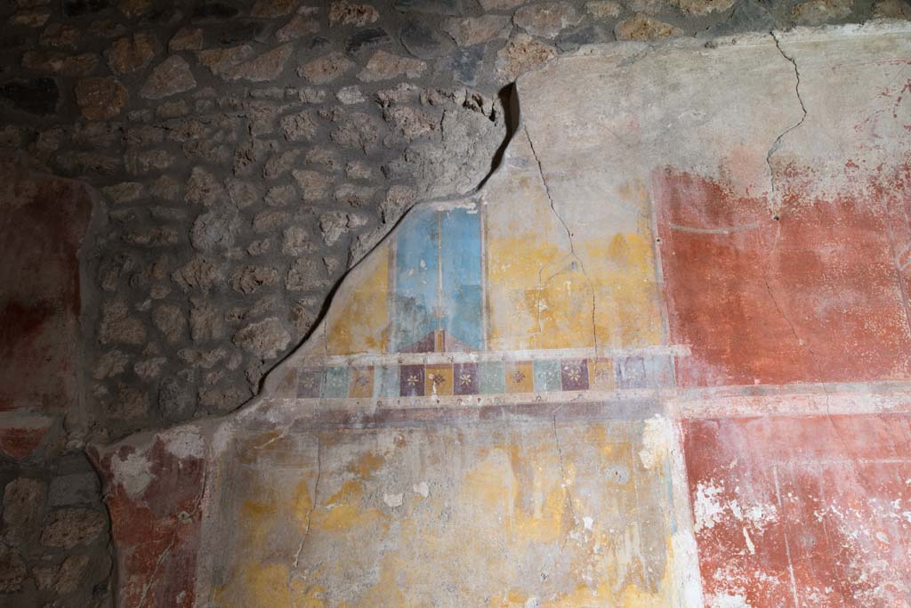I.14.15 Pompeii. January 2019. Detail of painted decoration from north wall of a room on north side of bar-room.
Photo courtesy of Johannes Eber.