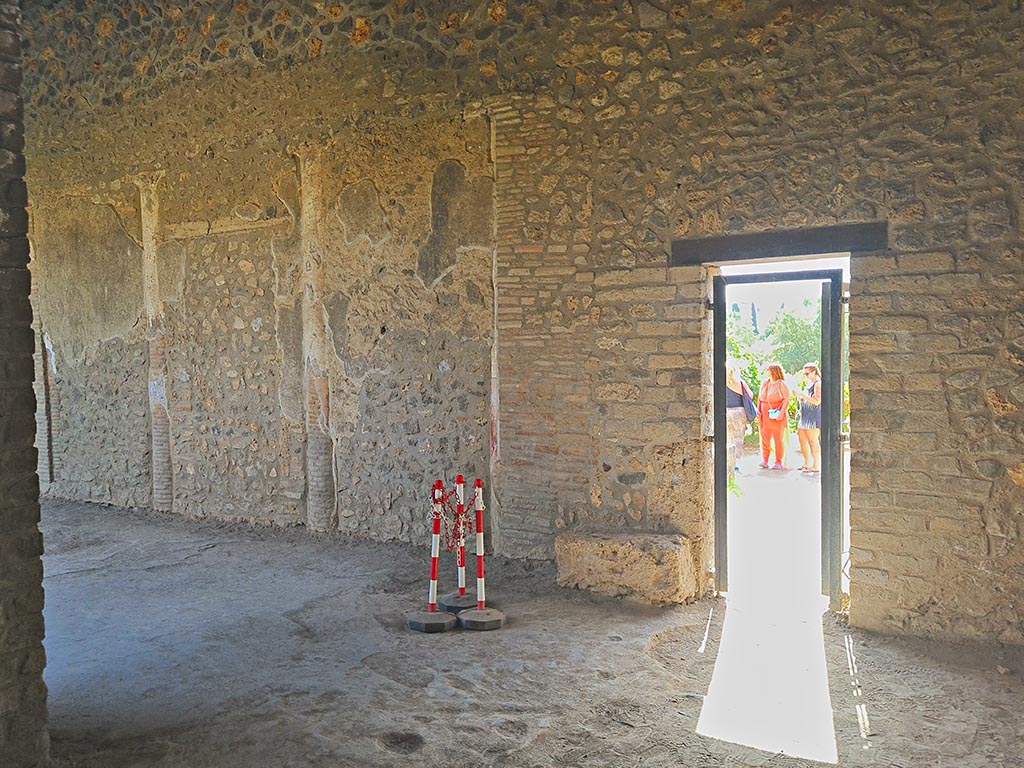 I.15.3 Pompeii. September 2024. 
Looking through doorway into garden area 14, in south wall of portico 10. Photo courtesy of Giuseppe Ciaramella.
