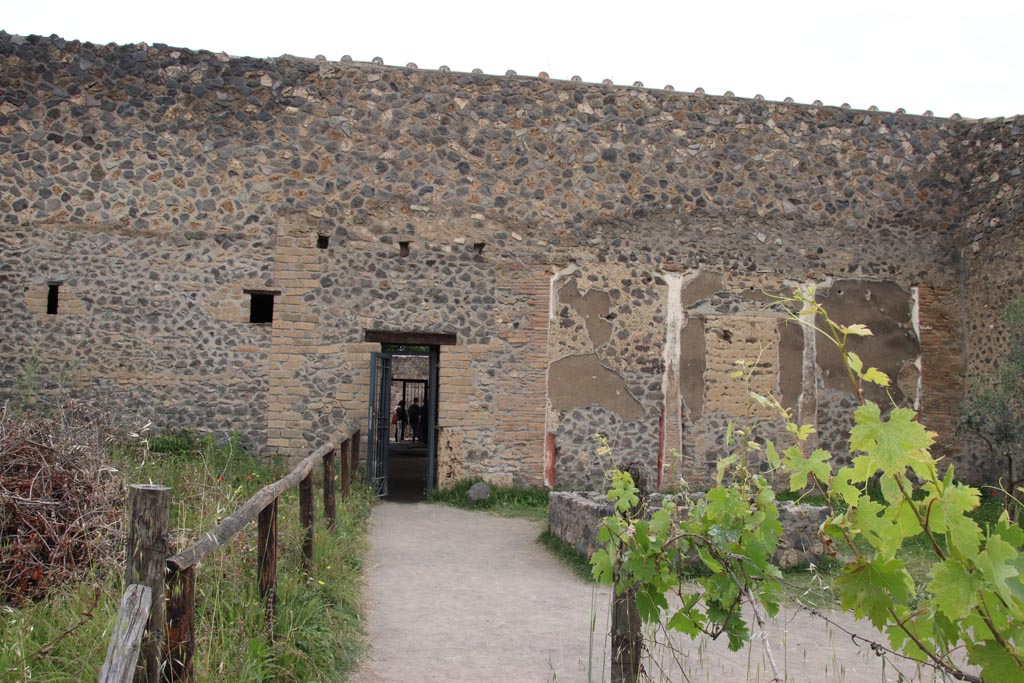 I.15.3 Pompeii. May 2024. Garden/vineyard, area 14.
Looking north towards doorway to south portico, and through to entrance doorway. Photo courtesy of Klaus Heese.