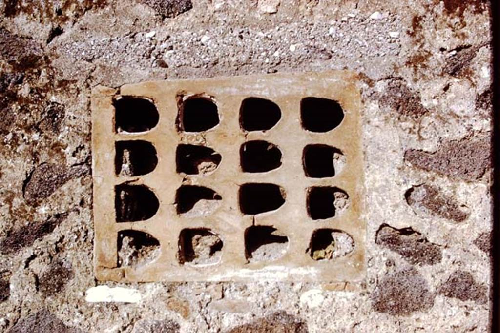 I.15.3 and I.15.5/6 Pompeii. 1972. Terracotta window from north end of rear wall of I.15.5/6. Photo by Stanley A. Jashemski. 
(Note: On first view we thought this photo was sideways on, but looking at the above photo, this is the way it is in the wall.)
Source: The Wilhelmina and Stanley A. Jashemski archive in the University of Maryland Library, Special Collections (See collection page) and made available under the Creative Commons Attribution-Non Commercial License v.4. See Licence and use details.
J72f0613