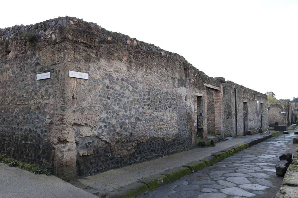 I.16.1 Pompeii, centre left. December 2018. 
Looking west along north side of insula between I.16.1 to I.16.4. Photo courtesy of Aude Durand.