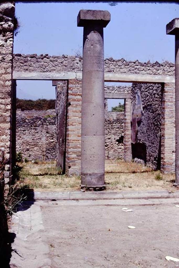 I.16.2 Pompeii. 1974. Looking north across peristyle towards entrance corridor, on left, and I.16.1a, on right. Photo by Stanley A. Jashemski.   
Source: The Wilhelmina and Stanley A. Jashemski archive in the University of Maryland Library, Special Collections (See collection page) and made available under the Creative Commons Attribution-Non Commercial License v.4. See Licence and use details. J74f0722