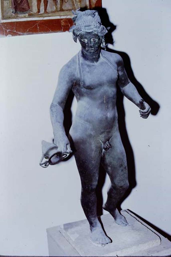 I.16.2 Pompeii. 1971. Bronze statue of Bacchus. SAP 11864.  Found 26th September 1957.  Photo by Stanley A. Jashemski.
Source: The Wilhelmina and Stanley A. Jashemski archive in the University of Maryland Library, Special Collections (See collection page) and made available under the Creative Commons Attribution-Non Commercial License v.4. See Licence and use details.
J71f0158