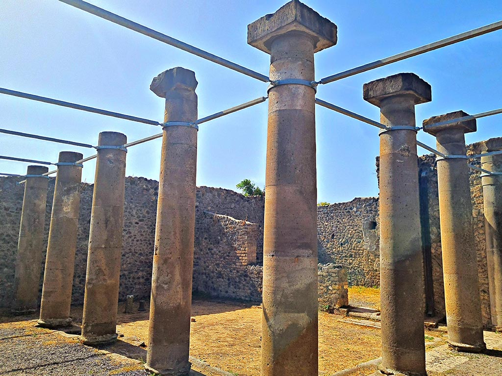 I.16.2 Pompeii. September 2024. 
Looking south-west across pseudoperistyle towards large triclinium. Photo courtesy of Giuseppe Ciaramella.