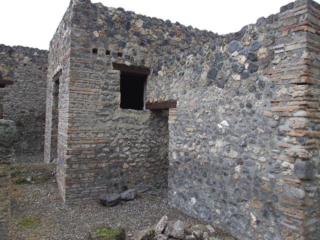 I.16.4 Pompeii. December 2006. Looking north from garden towards doorway to summer triclinium, and doorway to kitchen (centre).  The mound at the front of the doorway to the summer triclinium is the Sarno Canal which passes through the house