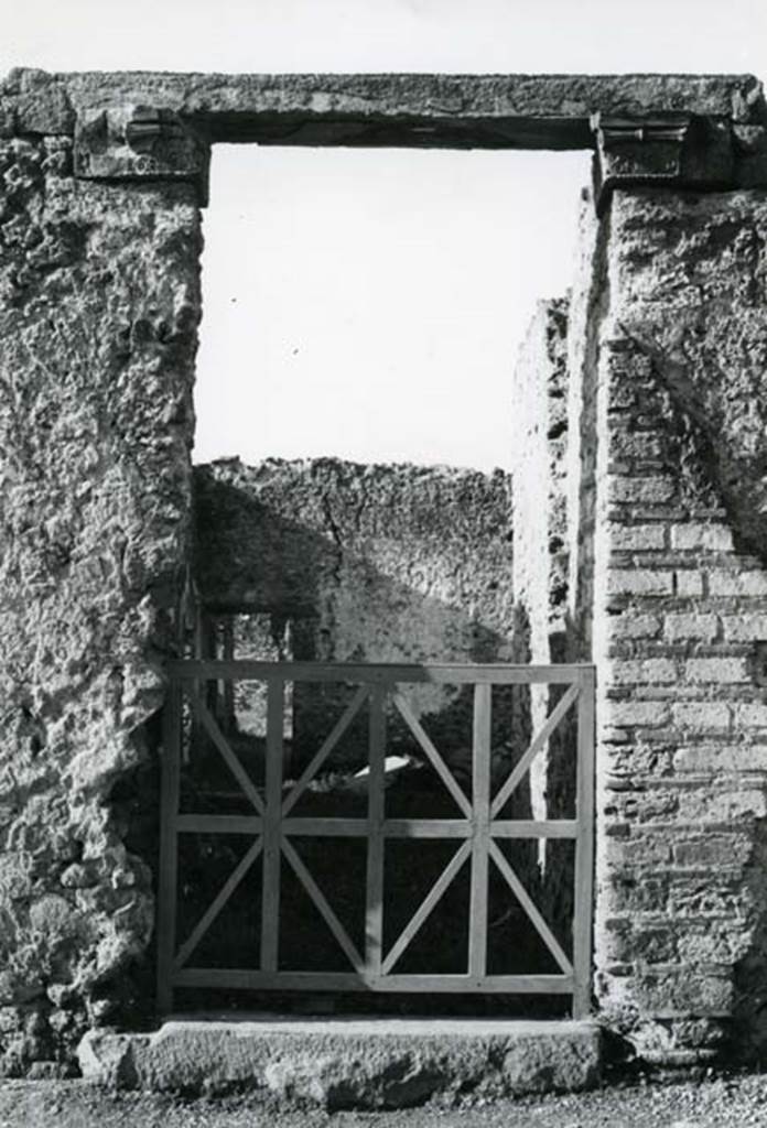 I.20.4 Pompeii. 1975. Shop House, entrance, pilaster capitals.  Photo courtesy of Anne Laidlaw.
American Academy in Rome, Photographic Archive. Laidlaw collection _P_75_7_23.