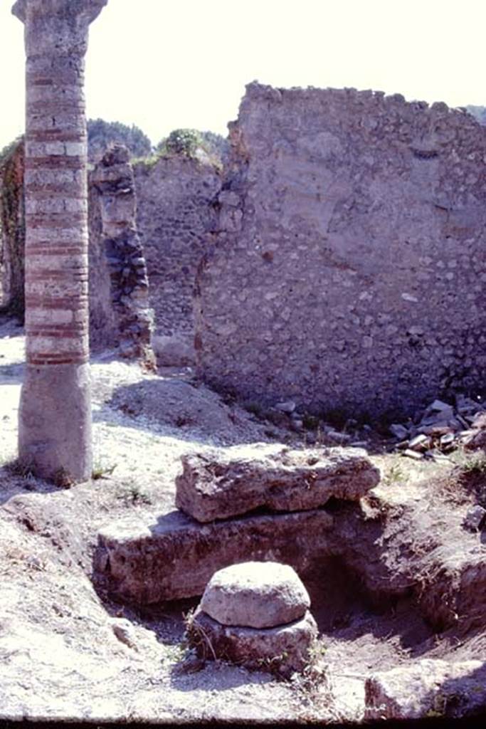 I.21.1 Pompeii. 1974. Looking east towards column and column base in Via della Palestra. Photo by Stanley A. Jashemski.   
Source: The Wilhelmina and Stanley A. Jashemski archive in the University of Maryland Library, Special Collections (See collection page) and made available under the Creative Commons Attribution-Non Commercial License v.4. See Licence and use details. J74f0710