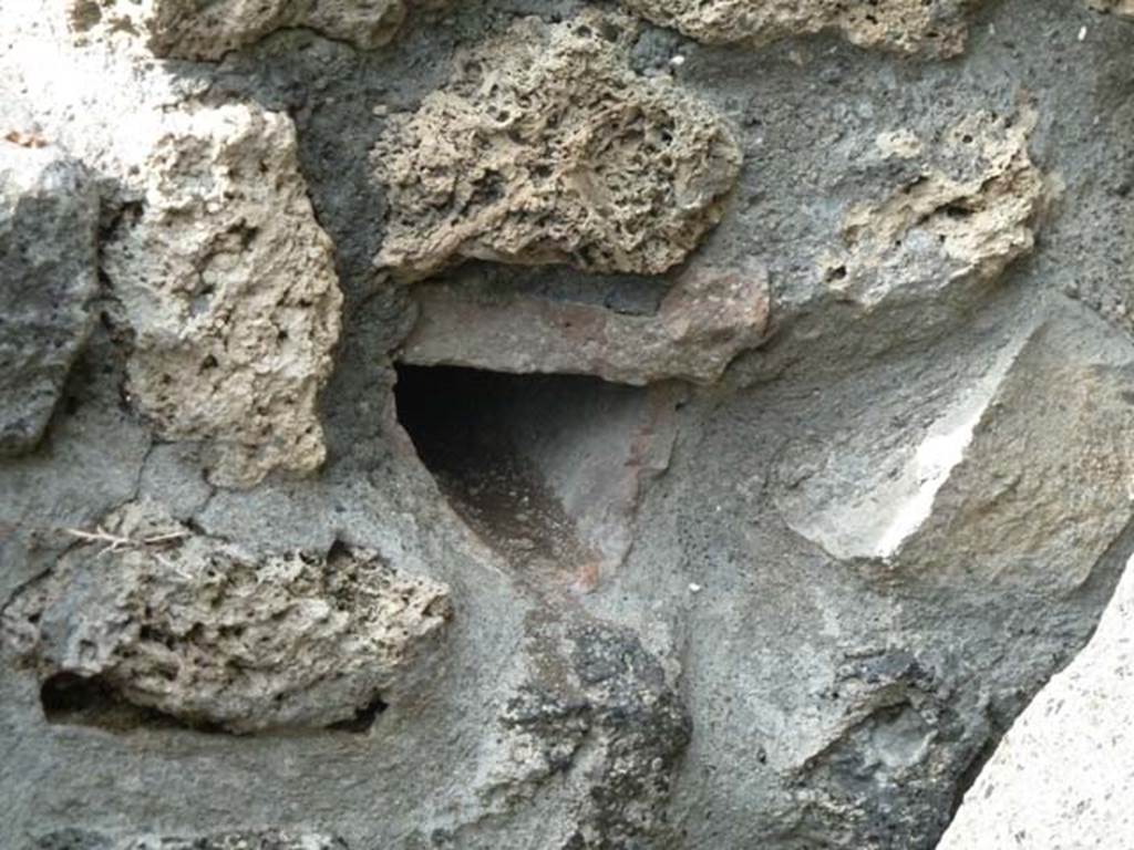 I.21.3 Pompeii. September 2015. Tile lined opening built into the wall to the east of the top step, used to channel the overflow water from the streetasa source of watering the garden area.
See Jashemski, W. F., 1993. The Gardens of Pompeii, Volume II: Appendices. New York: Caratzas. (p.71)