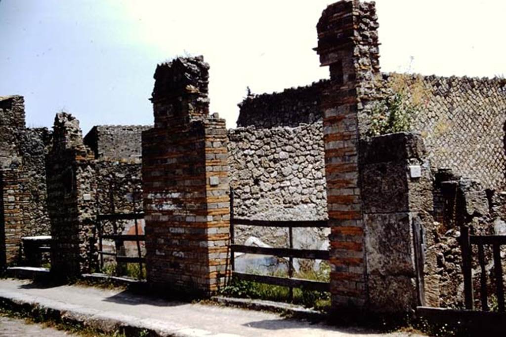 II.1.3 Pompeii. 1961. Looking towards entrance doorway, on right, on south side of Via dell’Abbondanza. On the left is the doorway for II.1.6, II.1.7 and II.1.8.    Photo by Stanley A. Jashemski.
Source: The Wilhelmina and Stanley A. Jashemski archive in the University of Maryland Library, Special Collections (See collection page) and made available under the Creative Commons Attribution-Non Commercial License v.4. See Licence and use details.
J61f0638