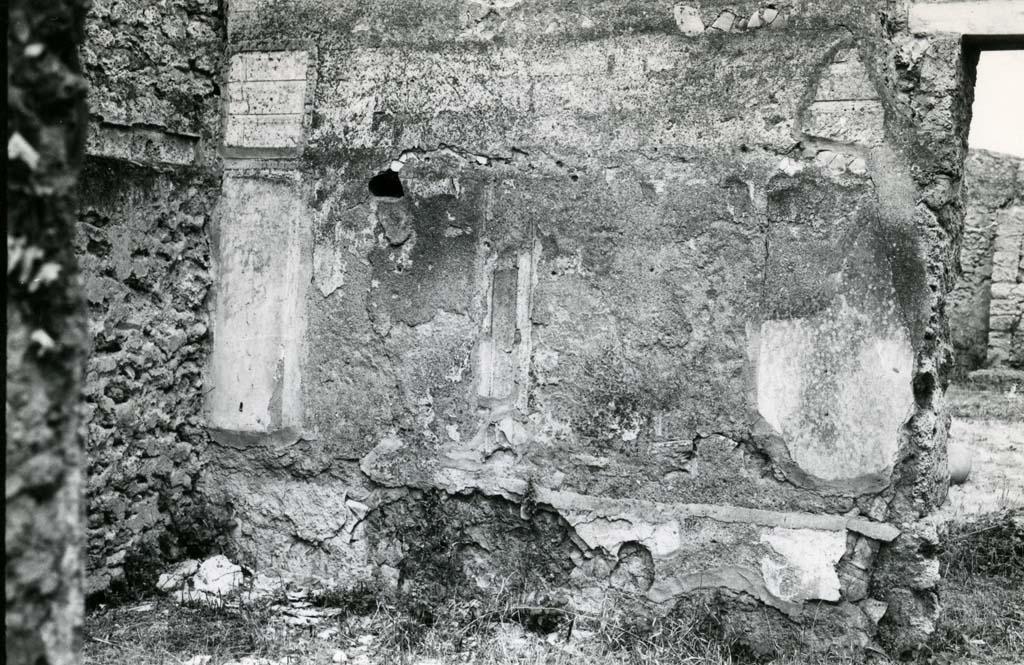 II.1.11/12 Pompeii. 1974. 
Oblong room SW of peristyle, N wall by NW corner, and doorway to peristyle area. Photo courtesy of Anne Laidlaw.
American Academy in Rome, Photographic Archive. Laidlaw collection _P_74_1_30.