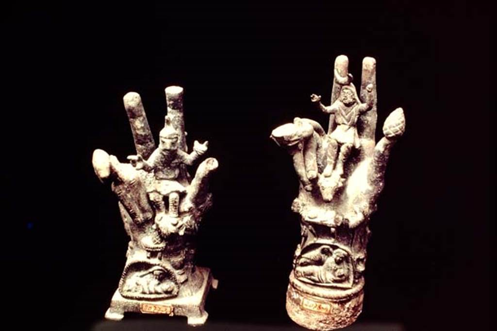 II.1.12 Pompeii, 1978. Cult objects of two bronze hands. Photo by Stanley A. Jashemski.   
Source: The Wilhelmina and Stanley A. Jashemski archive in the University of Maryland Library, Special Collections (See collection page) and made available under the Creative Commons Attribution-Non Commercial License v.4. See Licence and use details. J78f0414