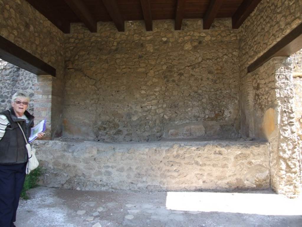 II.1.12 Pompeii. March 2009. East wall of Sacellum with high podium or bench, which extends the width of the room.