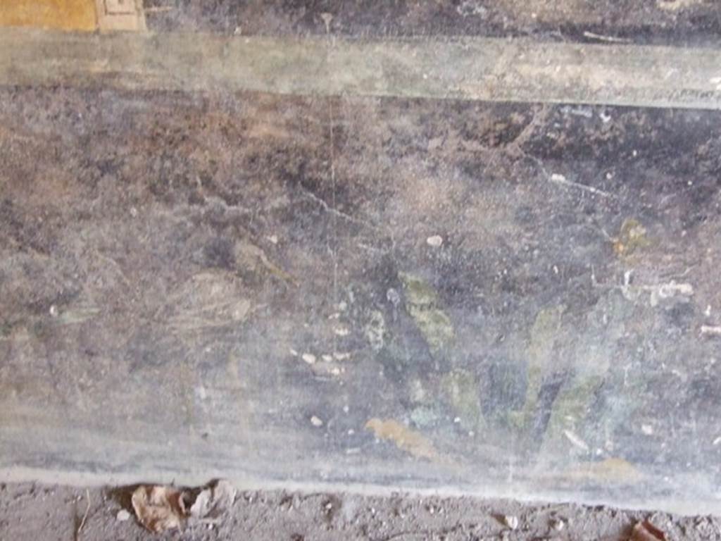 II.1.12 Pompeii. March 2009. Painted plants and heron, on zoccolo on lower north wall at west end of triclinium.